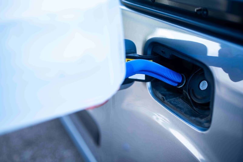 pouring-adblue-car-male-driver-adding-diesel-exhaust-fluid-his-car